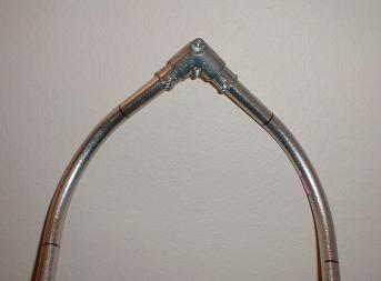 A snowshoe frame with a fitted pull elbow