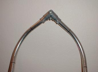 A snowshoe frame with a fitted pull elbow