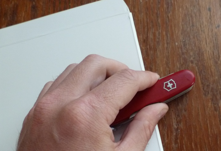 Burnishing the crease with a Swiss Army Knife.